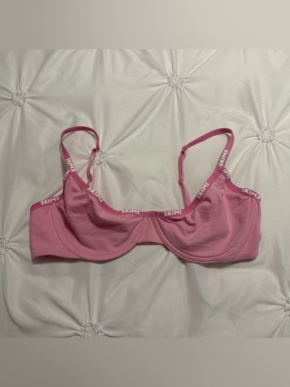 pink skims logo bra